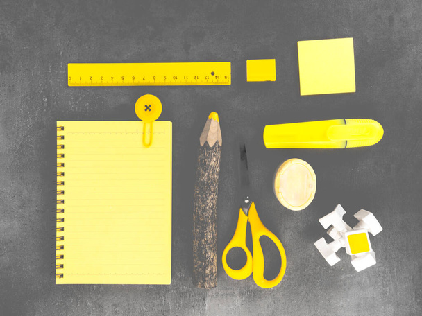 office desk with accessories background on trendy colors, school yellow supplies on a ultimate gray background. Flat lay, top view. Back to school concept. Copy space for you text - Photo, Image