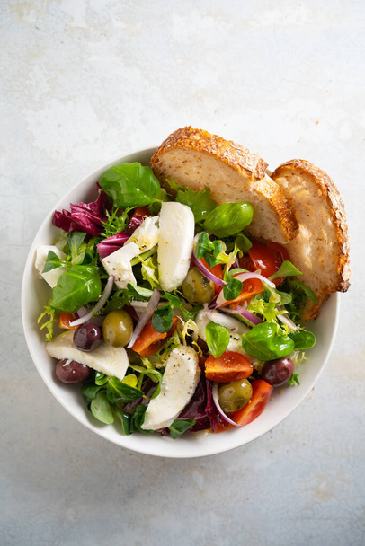 Fresh green salad with cherry tomato, mozzarella and olives. - Photo, image