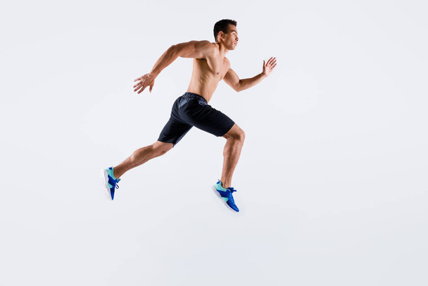 Full length body size view of his he nice attractive professional sportive tall purposeful guy jumping running long distance motivation isolated over light white pastel color background - Φωτογραφία, εικόνα