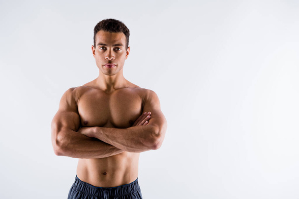 Portrait of his he nice attractive serious content tanned guy ripped shape figure professional competitor steroids folded arms isolated on light white pastel color background - Foto, Imagem