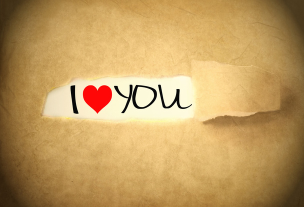 я люблю тебя, написанную под рваной бумажной лентой
 - Фото, изображение