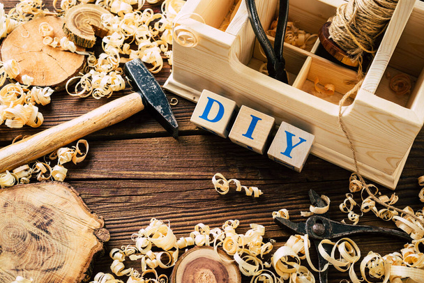 Do it Yourself wood. Woodworking workshop. DIY. Wood shavings and carpentry tools. Copy Space - Photo, Image