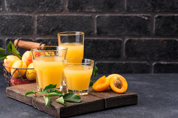 Apricot juice in glass. Healthy drink - Fotoğraf, Görsel