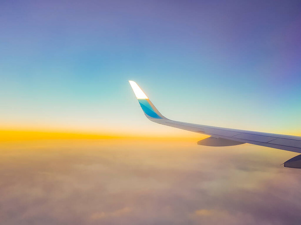 Flying over Europe from Germany to Mallorca at the beautiful colorful sunset. - 写真・画像