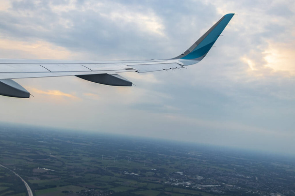 Flying over Bremen Germany with view from the airplane window on the land. - 写真・画像