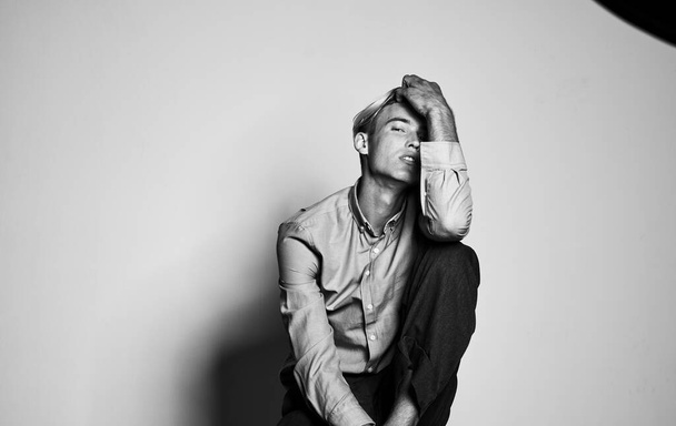 Portrait of a sexy man in a shirt and trousers black and white photography - 写真・画像
