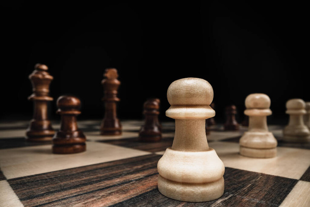 Macro shot of wooden chess figures on board - Foto, Imagen