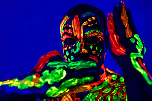 afro american man posing in studio shot with UV light - Φωτογραφία, εικόνα