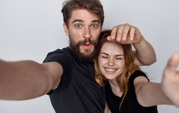 cheerful young couple lifestyle studio friendship emotions isolated background - Foto, Bild