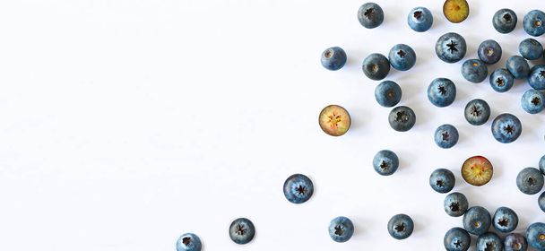 Blueberries scattered on white background banner. High quality photo - Photo, Image