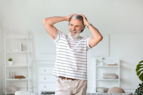 Portrait of mature man resting at home - Photo, Image