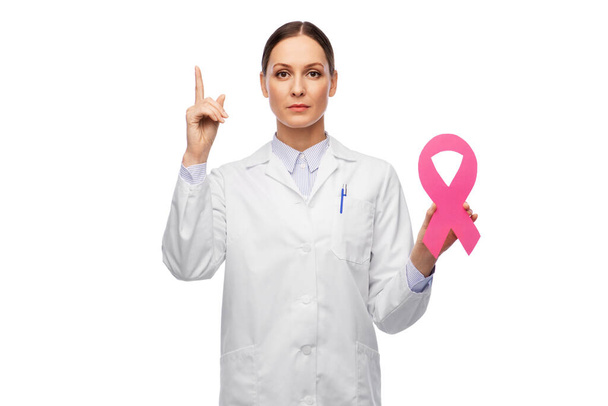 female doctor with breast cancer awareness ribbon - Zdjęcie, obraz