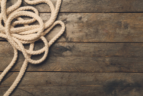 Long rope on wooden background - Photo, Image
