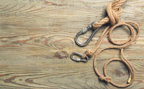 Ropes with lobster clasps on wooden background - Photo, Image