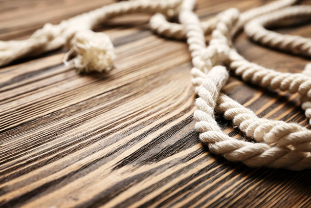 Long rope on wooden background - Fotó, kép