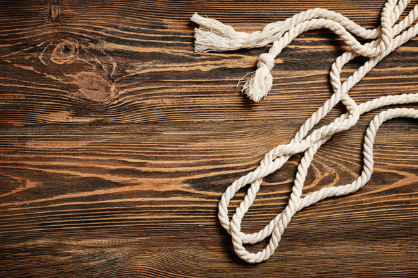 Long ropes on wooden background - Photo, Image
