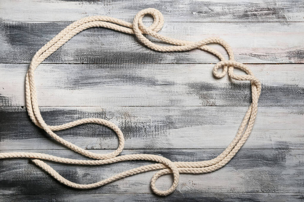 Frame made of rope on wooden background - Foto, Bild