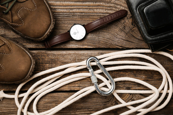 Set of travel items with rope on wooden background - Fotó, kép