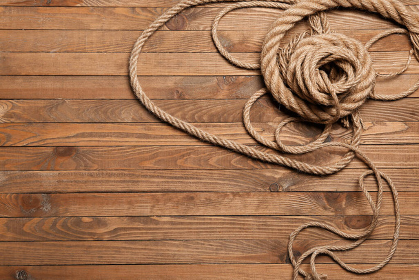 Long ropes on wooden background - Photo, Image