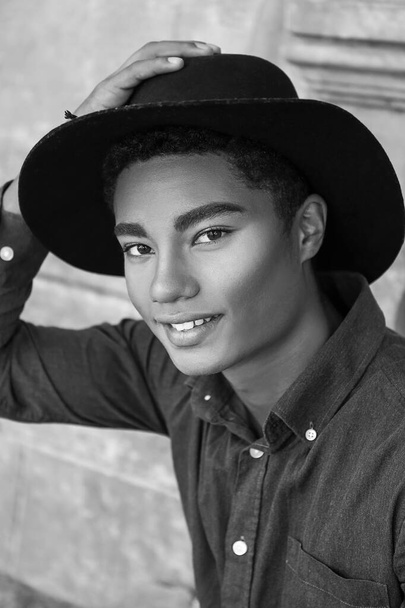 Black and white portrait of stylish young African-American man outdoors - Photo, Image