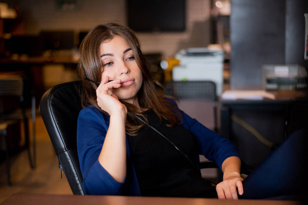Beautiful caucasian woman call center operator at work desk. - Photo, Image