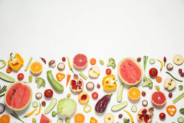 Fresh organic fruits and vegetables on white background, flat lay. Space for text - Valokuva, kuva
