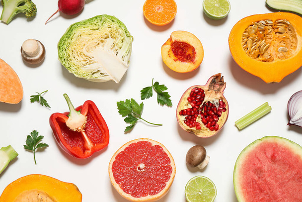 Fresh organic fruits and vegetables on white background, flat lay - Photo, Image