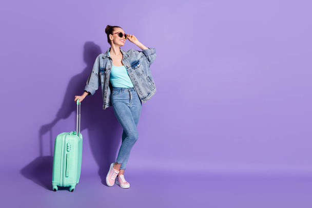 Full length body size view of her she nice attractive pretty slim fit glad cheerful cheery girl going voyage airport tour isolated on bright vivid shine vibrant lilac purple violet color background - Foto, Imagem