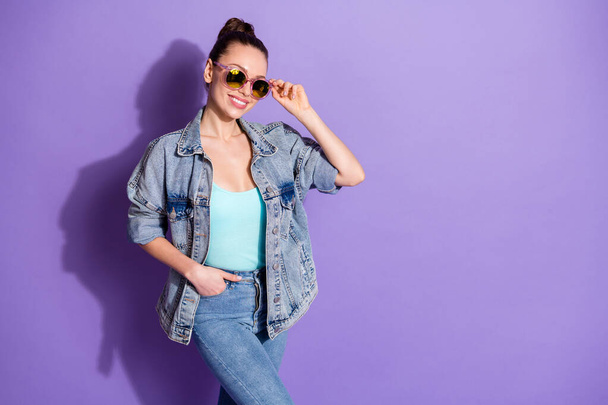 Portrait of content attractive sweet girl youth touch her modern specs enjoy free time wear singlet isolated over violet color background - Photo, Image
