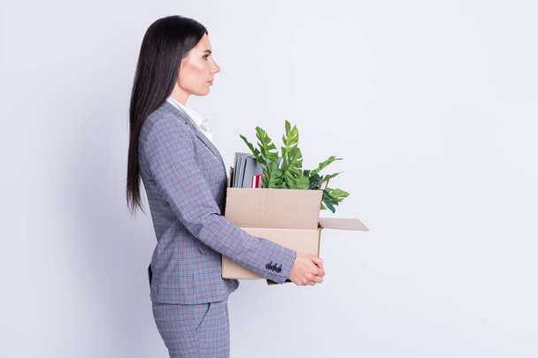 Profile photo of displeased worker lady world finance crisis lost job work hold carton box own stuff fired quit leave office building for good proud formalwear isolated grey color background - Fotografie, Obrázek