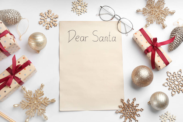 Flat lay composition with letter saying Dear Santa on white background. Space for text - Foto, afbeelding