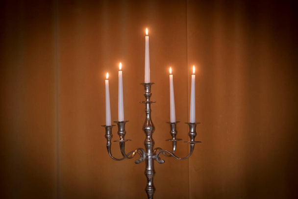 an atmospheric and warm light from candle, candles for festive lightning - Zdjęcie, obraz
