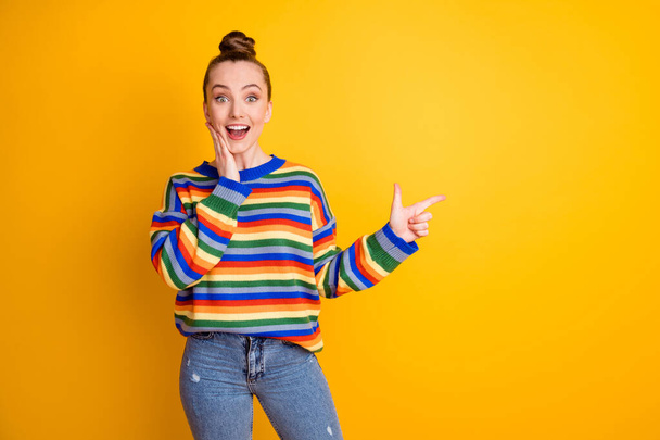 Portrait of astonished excited girl point index finger copyspace impressed adverts promo touch hand face decide choose advise wear jumper isolated over bright color background - Foto, immagini