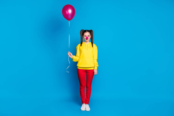 Full length body size view of her she nice attractive sad bored girl circus carnival clown holding in hand helium ball isolated over bright vivid shine vibrant blue color background - Foto, immagini