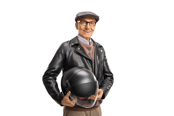 Elderly man in a leather jacket holding a helmet isolated on white background - Photo, image