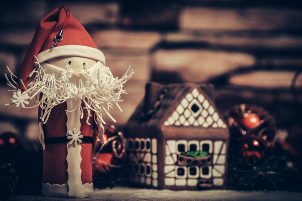 gift for Christmas ,gingerbread house, a toy Santa Claus. - Фото, зображення
