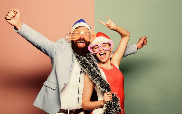 Christmas fun. happy family couple celebrate xmas. santa man and woman with tinsel. merry christmas. preparation to winter holidays. celebrate together. people in party glasses. happy new year party - Fotoğraf, Görsel