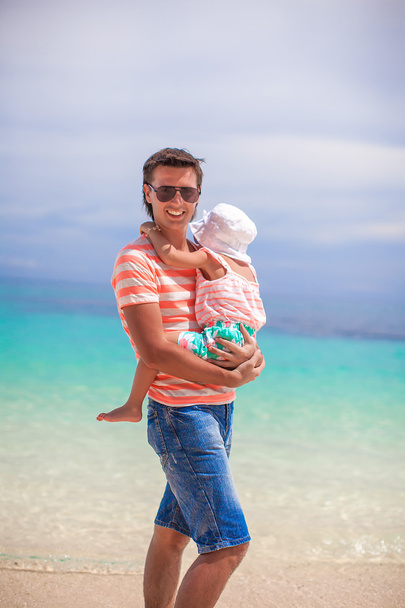 Young father and his adorable little daughter have fun at beach - Photo, Image