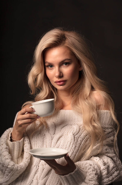 Blonde hair female model posing on camera  - Фото, изображение