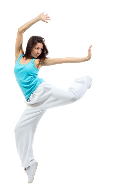 Young modern slim dancer girl exercise hip-hop style pose  - Photo, Image