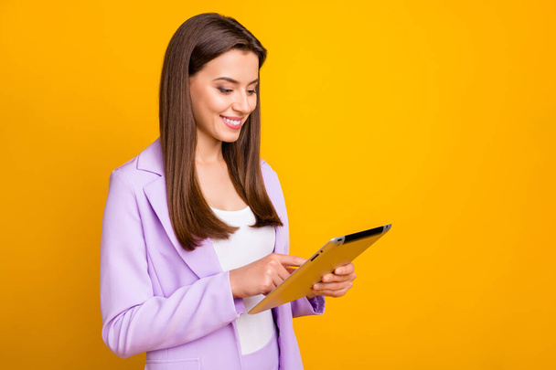 Profile photo of business lady holding e-book hands chatting colleagues partners deal corporate questions read email box wear lilac suit isolated yellow color background - Photo, Image