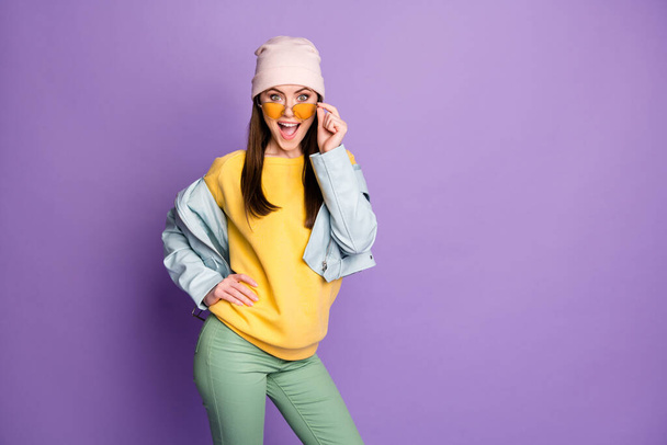 Portrait of astonished positive cheerful girl touch specs impressed wonderful novelty wear good look clothes isolated over purple color background - Fotografie, Obrázek