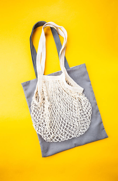 cotton bags on yellow - Foto, afbeelding