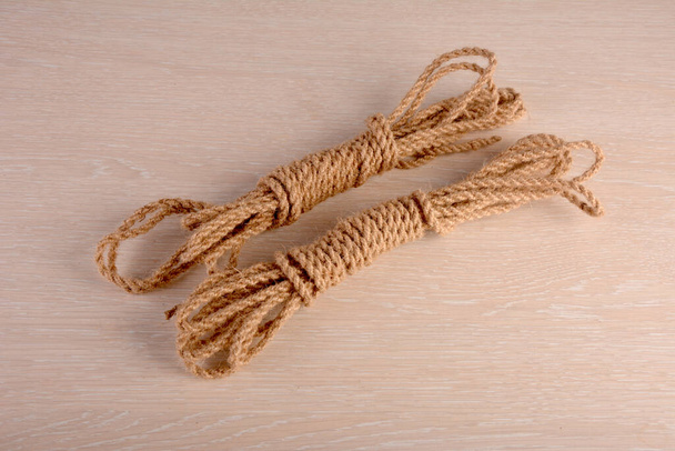 Natural jute rope, vegetable fiber woven into a thick thread close-up textured effect. Natural plant material. Hemp or linen rope. - Photo, Image