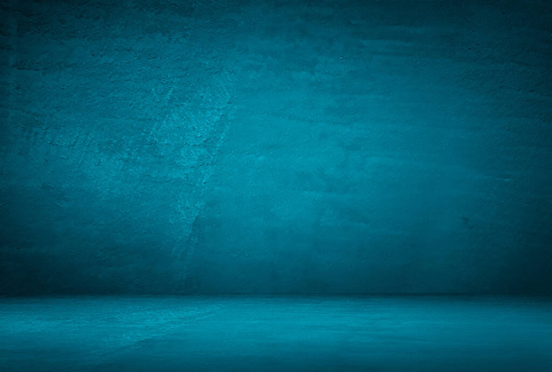 Vintage grunge μπλε τσιμεντένια υφή στούντιο τοίχο φόντο με βινιέτα. - Φωτογραφία, εικόνα