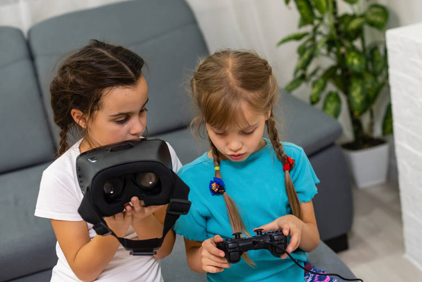 Young girls with virtual reality glasses. VR headset. - Photo, Image