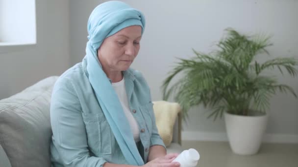 Mature woman after chemotherapy going to take medicine at home - Footage, Video