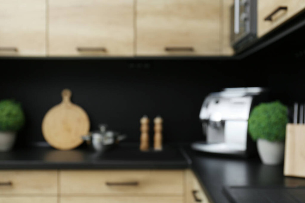 Blurred view of kitchen interior with modern furniture - Fotó, kép