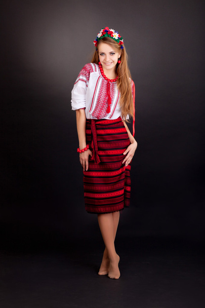 Attractive woman wears Ukrainian national dress - Фото, изображение