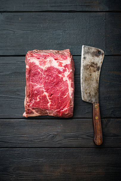 Top sirloin beef steaks cut, on black wooden background, top view - Fotoğraf, Görsel